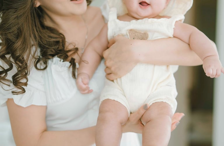 young family portrait inside Bali villa living room