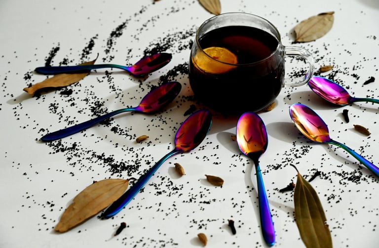 a cup of tea with spoons and spoons on a table