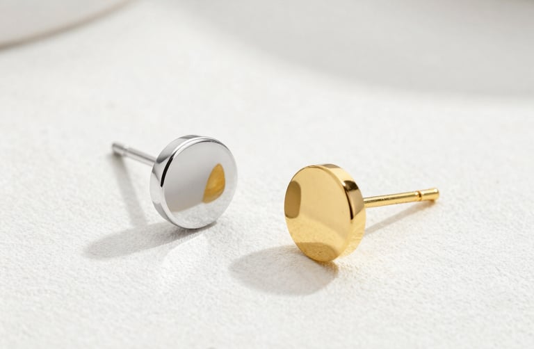 Close-up of elegant gold and emerald semijoias displayed on a moss green velvet cloth.