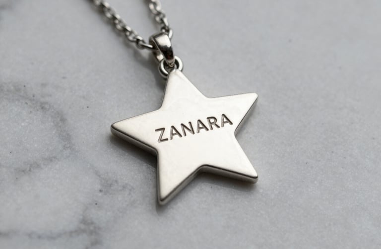 Elegant silver necklace with a minimalist design displayed on a white marble surface with soft natural light.