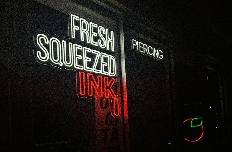 Exterior front window display at Orange Grove Tattoo