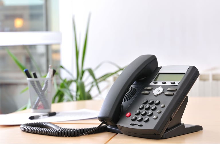 Desk phone used for VoIP calling in a professional office setting