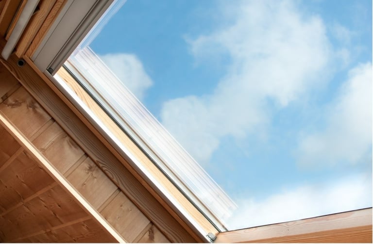 windows of roof with a skylight in the middle of a wooden ceiling