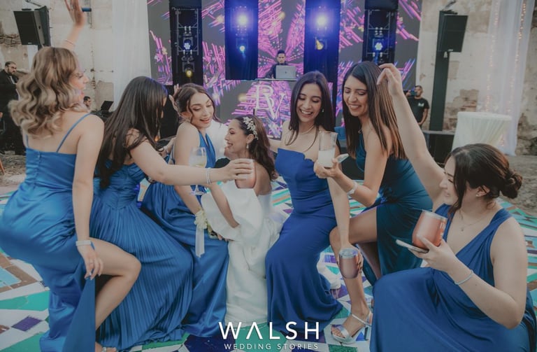 Bride dancing with bridesmaids