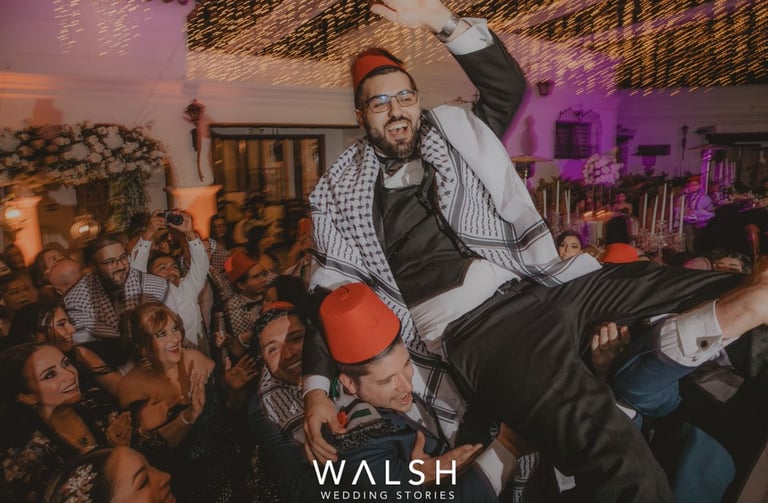 Antigua Guatemala Wedding Photographer-Groom carried by guys at party