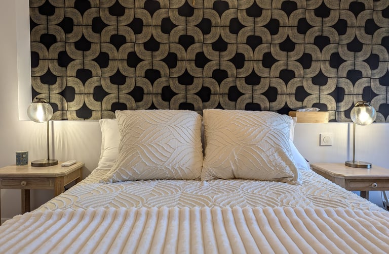 a bed with a white bed and a lamp