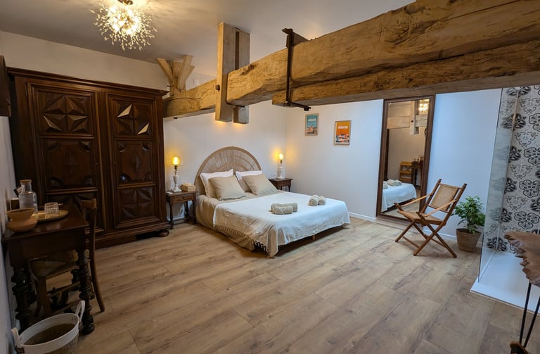 a bedroom with a bed and a chair