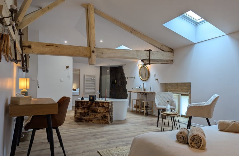 a bedroom with a bed, chair, and a desk
