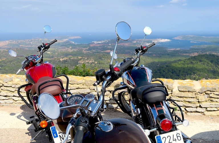 Motorcycle tour at a scenic viewpoint overlooking the coast of Menorca