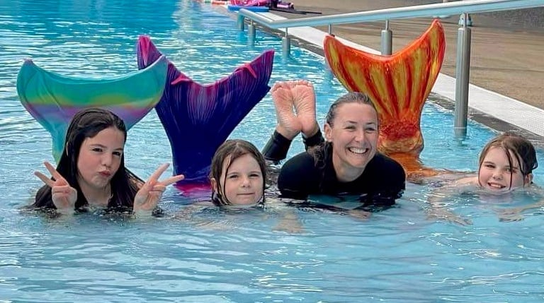 Kids learning to swim like a mermaid
