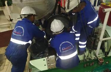 our service team on board the ship engine fixing turbocharger