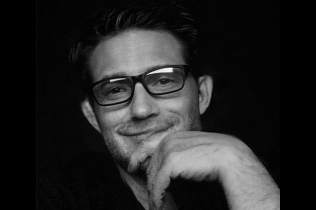 a man with glasses and a beard and glasses