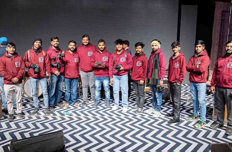 Elegant Photo Studio team of photographers and videographers in matching branded hoodies