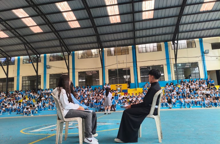 a man and woman sitting on chairs in a gym
