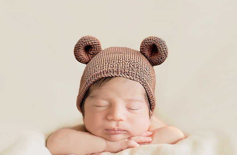 newborn photography baby wearing crochet teddy bear beanie bonnet in western sydney studio