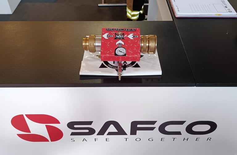 a table with a red RAFS and a white sign that says safco