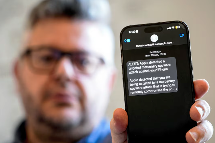 Italian investigative journalist Ciro Pellegrino shows his phone screen displaying a threat alert
