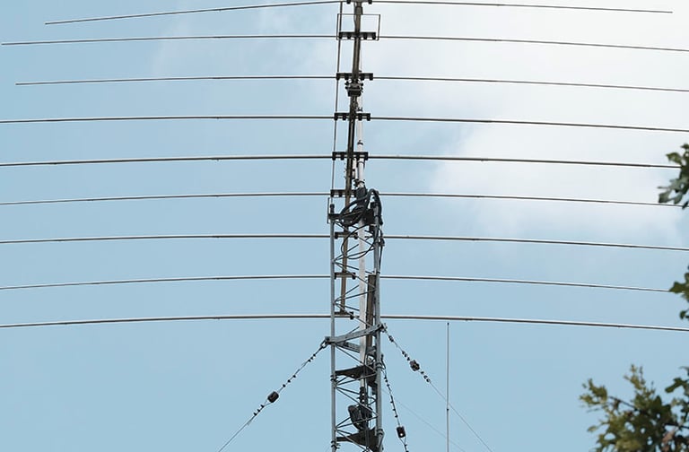 My amateur radio NA4M tower with antennas against the sky, used for receiving and transmitting signals around the world
