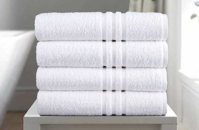 a stack of towels and a towel on a table