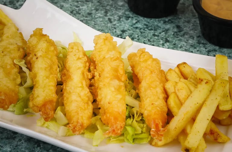 a plate of fried fried chicken nuggies and fries