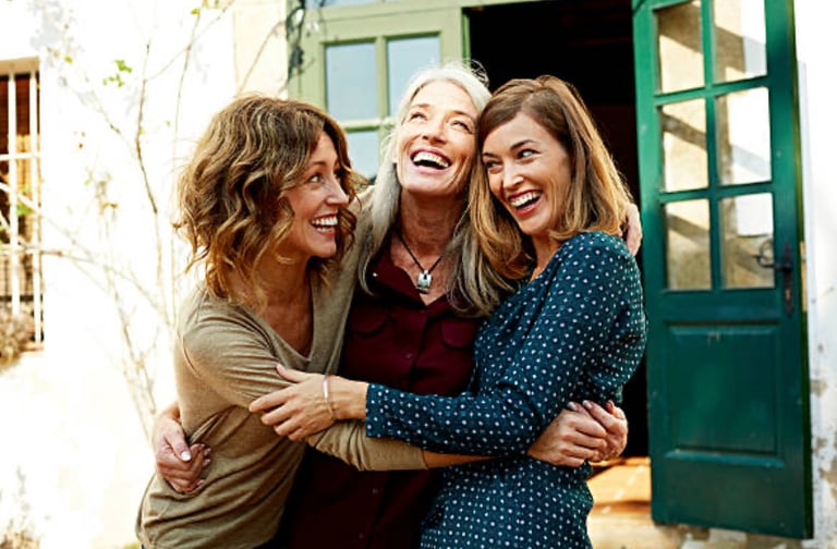 women of menopausal age having a group hug