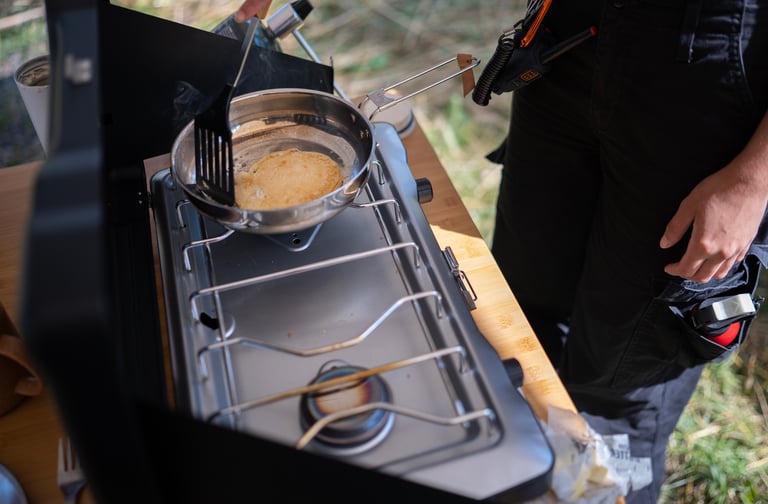 Cooking pancakes on a camp stove
