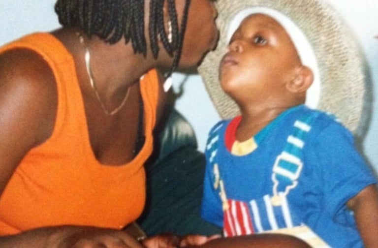 Black Mother kissing her son 