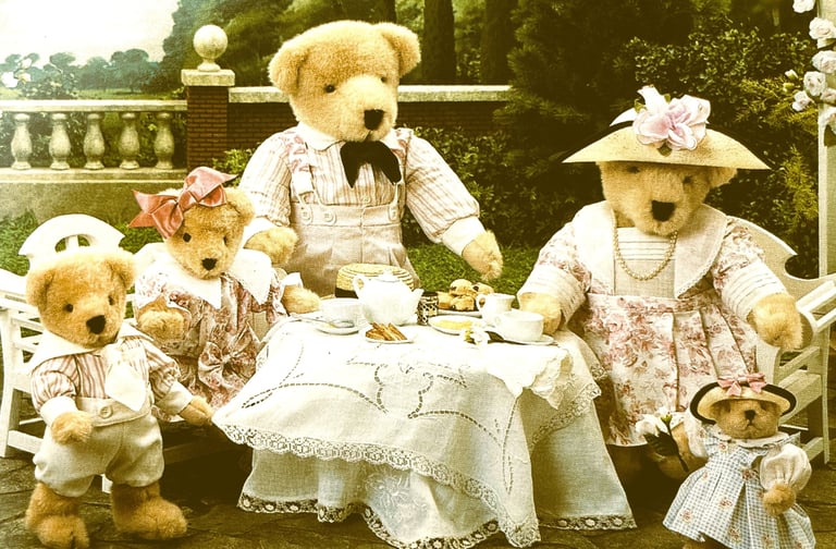 Muffy VanderBear family teddy bears having high tea in the garden dressed in pink & white party wear