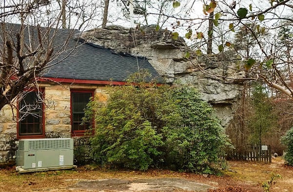 Mentone, AL - The Rock Church has a boulder stuck to it's back wall