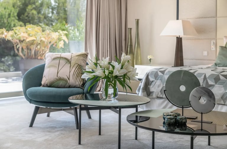 Villa Serenity suite with modern décor and floral arrangement