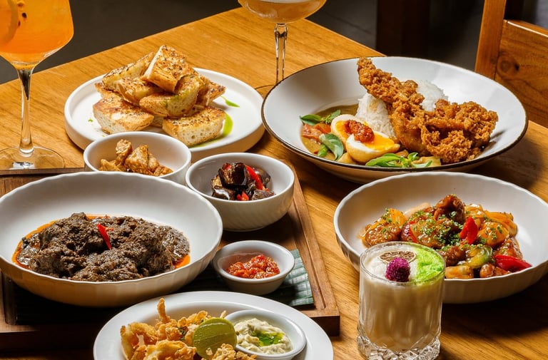 a table with plates of food and drinks