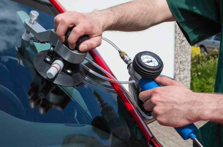a man is holding a hose and a hose in his hand