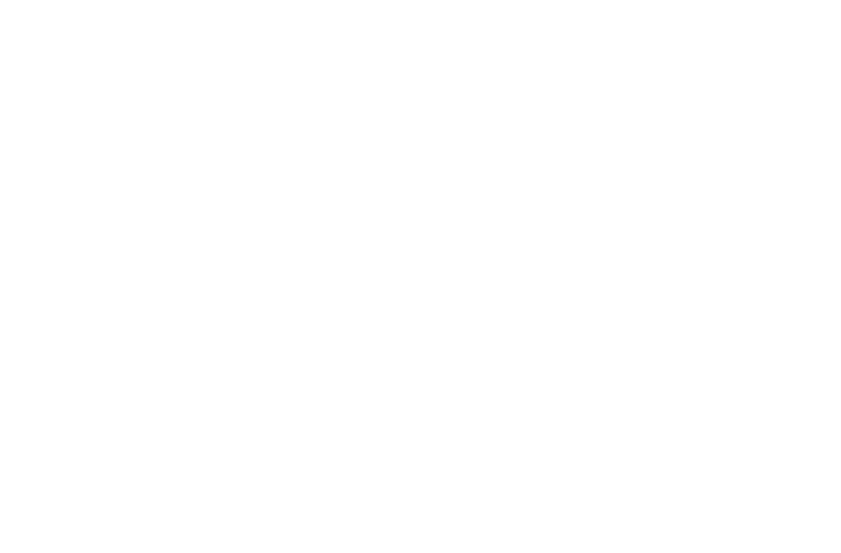 a dog is standing in front of a white square sign