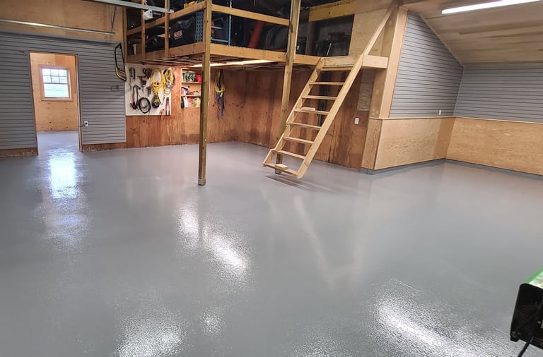 Residential garage floor with moisture barrier installed, oxide rolled in for non-slip texture