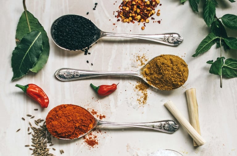 a variety of spices and spices in spoons and spoons