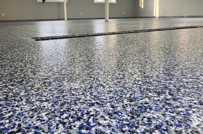 Residential garage floor coating with blue flake using MMA system, drain coated epoxy membrane
