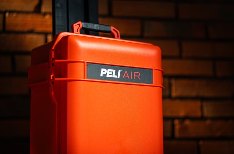 a red suitcase with a pelican air