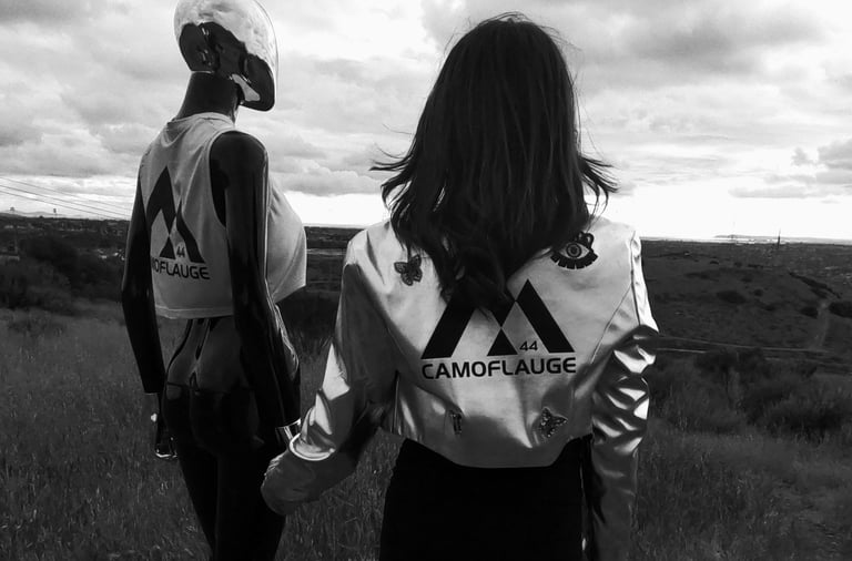 a dimensional being and woman standing in a field