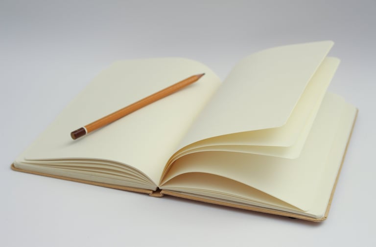 a pencil and pencil on a notebook with a pencil and pencil