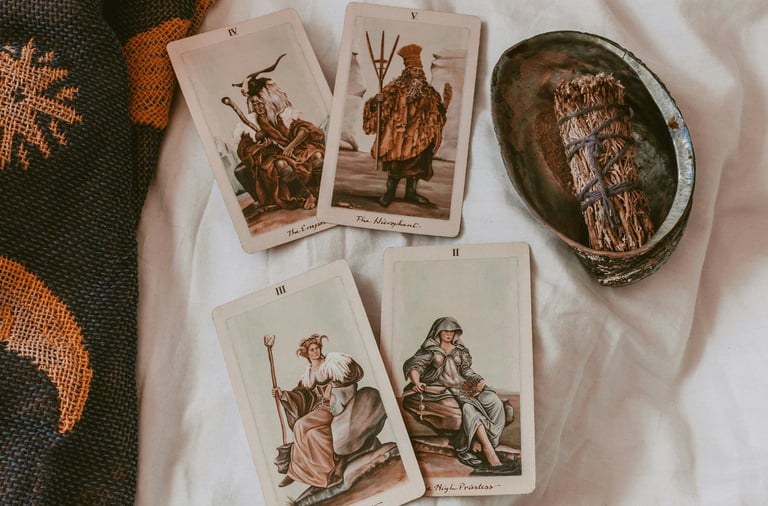 Tarot cards and sage bundle. Photo by Cat Crawford on Unsplash.