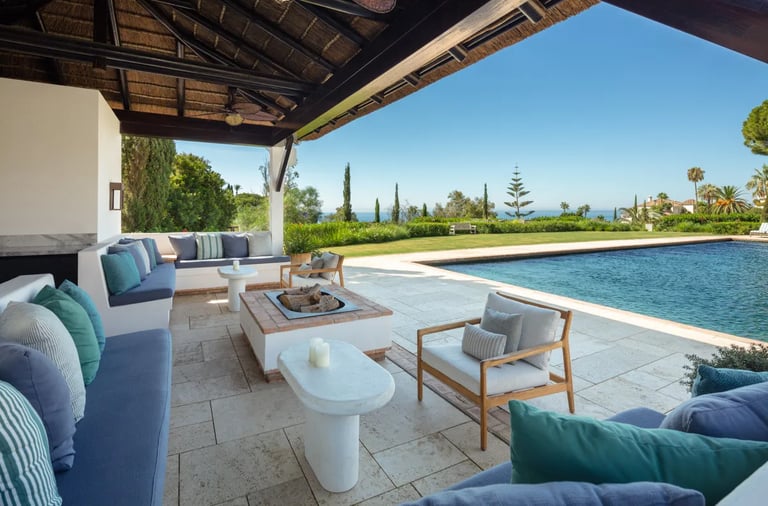 Terrace lounge at Villa La Gratitud with sea views and shaded seating