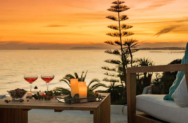 Sunset terrace with cocktails and candles overlooking the coastline