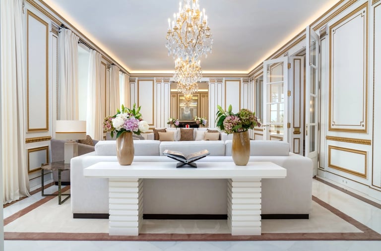 Ornate reception room with gold detailing and chandelier