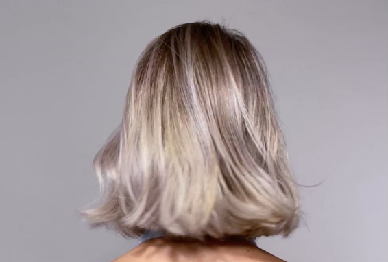 Close-up of woman's highlighted hair with soft waves