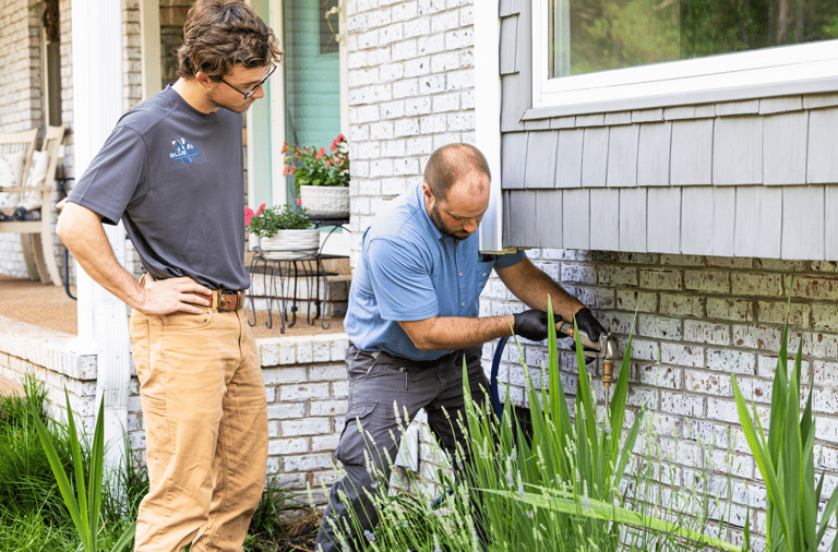 Clint Smith (Owner) Performing a pest control prevention operation