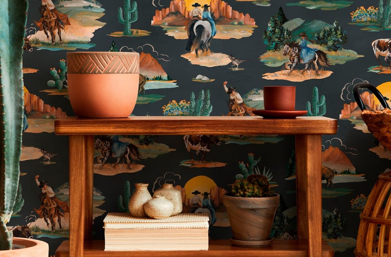 Rustic wooden shelf against western wallpaper featuring cowboys, horses, and desert cactus scenery.