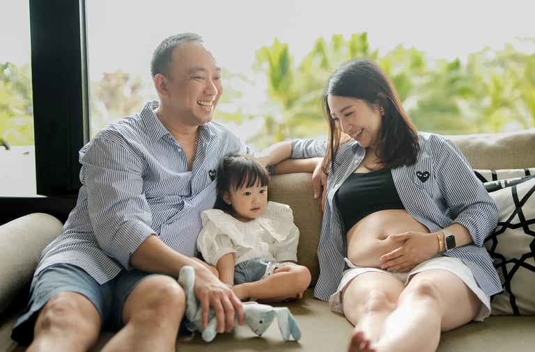 Family maternity photography session inside a luxury suite at The Apurva Kempinski Bali