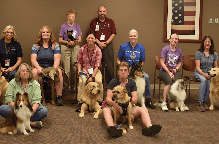 Members of Tender Paws pose for a photo with their Therapy Animals after the meeting on 4 August 202