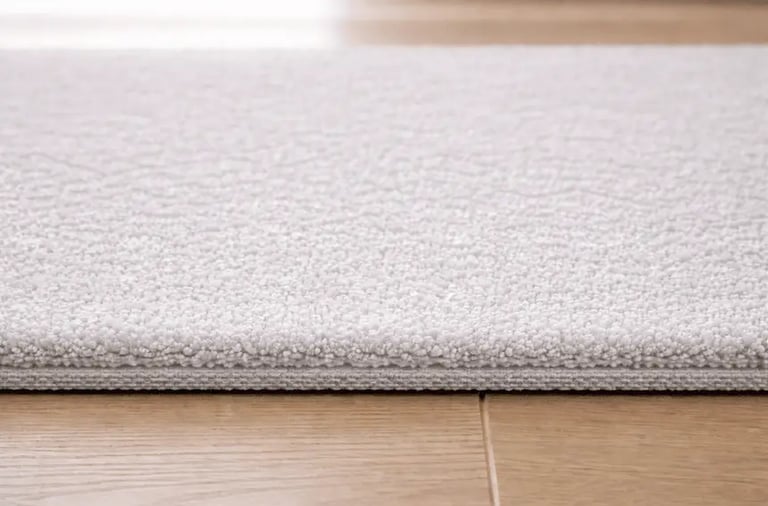 Low pile carpet with dense short fibers, smooth and durable
