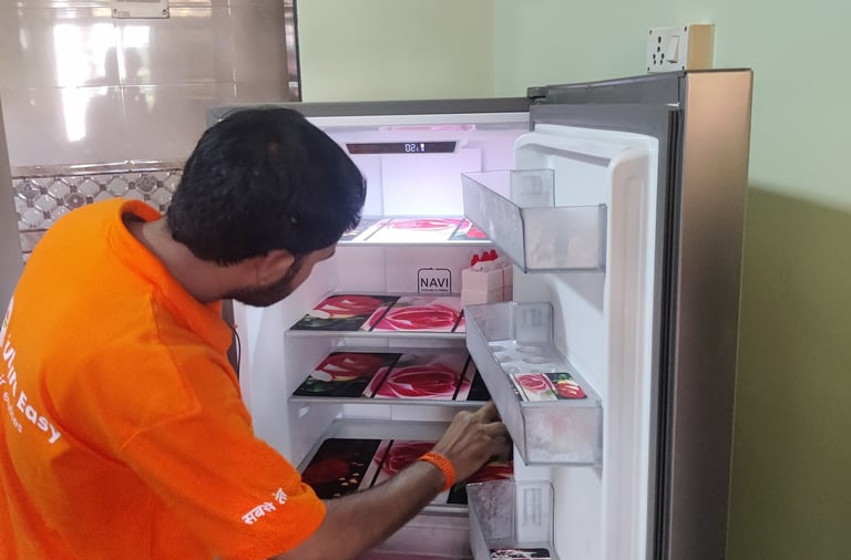 Appliance repair technician fixing a refrigerator in Jodhpur